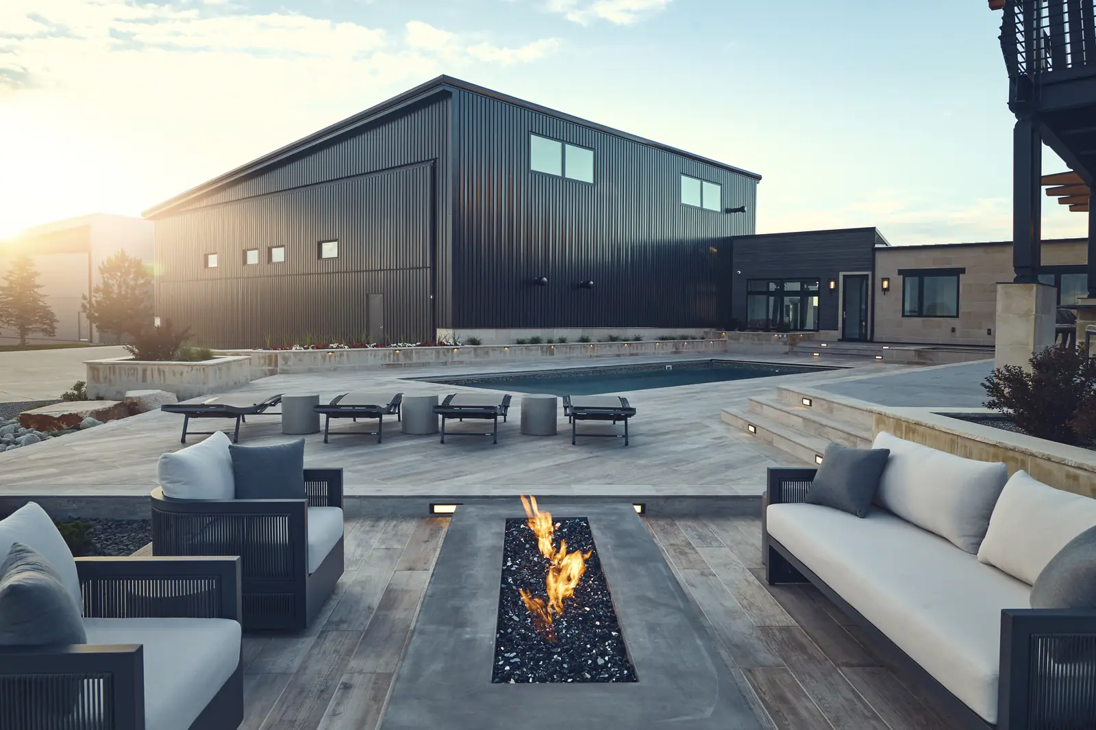 Fire lounge at golden hour looking across the lawn of a Colorado estate