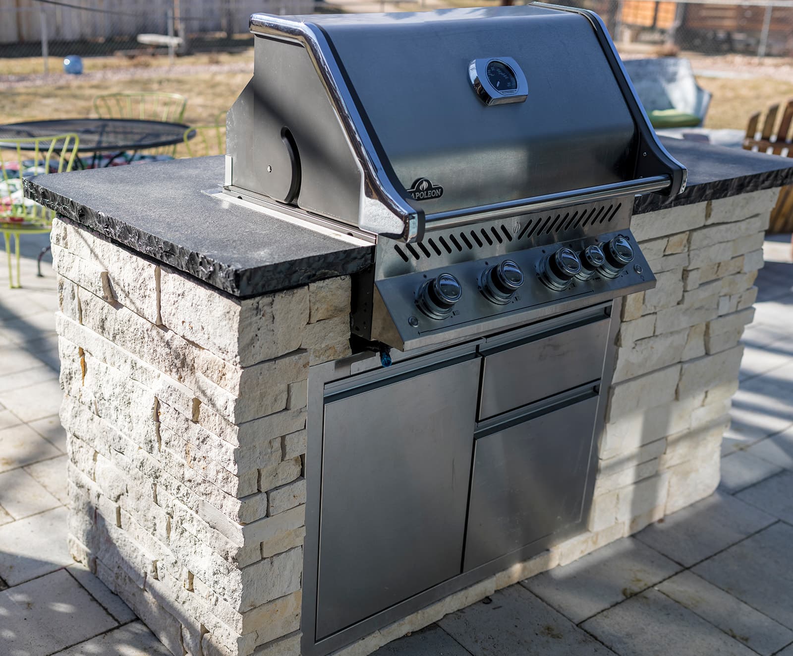 Complete outdoor living space with fire pit and paver patio in Colorado