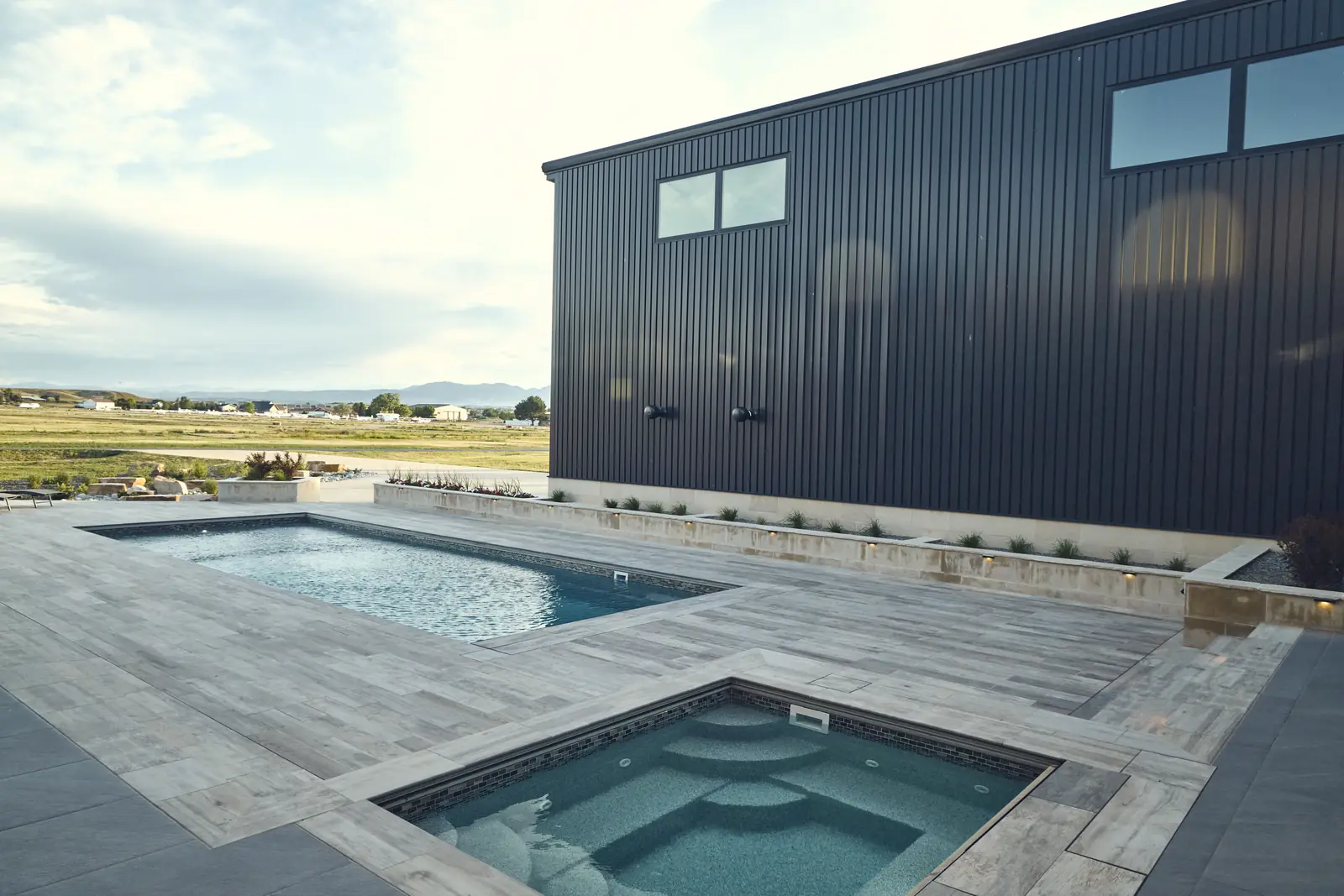 Custom concrete pool and square spa with open prairie beyond, Johnson Estate, Colorado