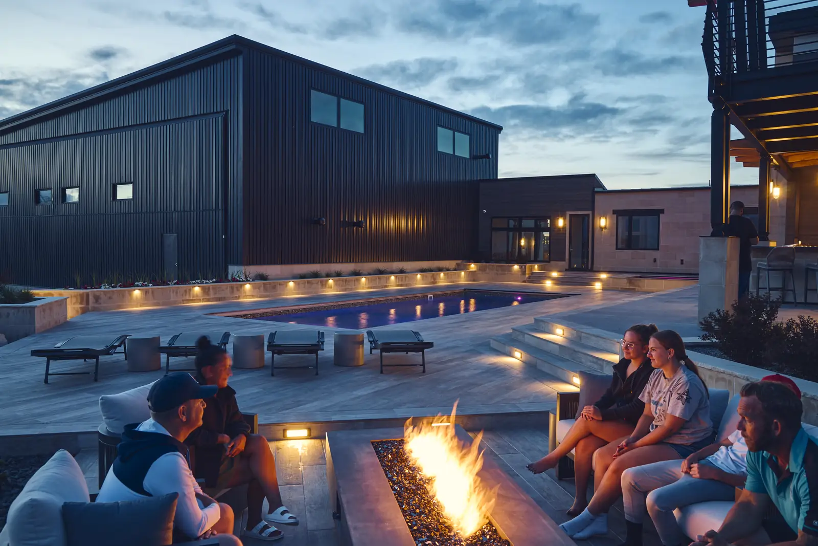 The Johnson Estate pool, spa, and sunken fire lounge at dusk